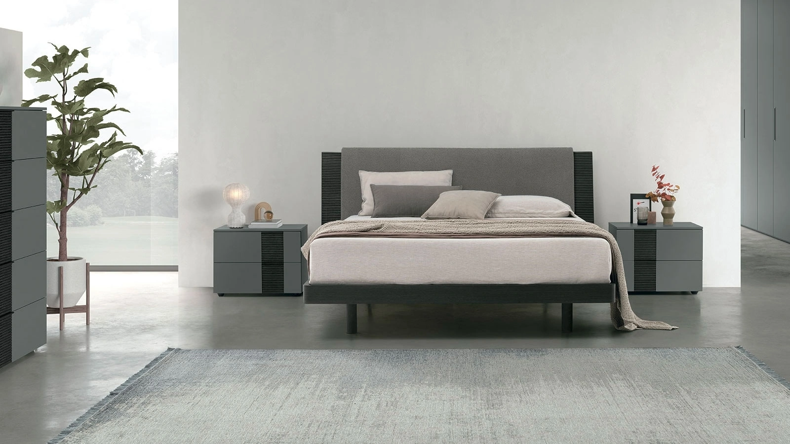 Letto matrimoniale Bliss in materico rovere con testiera ammorbidita da un pannello imbottito di Tomasella